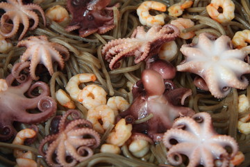 Seafood and noodles. Shrimps, octopus and buckwheat noodles.