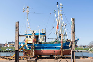 Fototapeta na wymiar fishing vessel in dockyard for maintenance