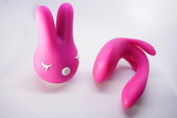 bright sex toys on white background in the studio