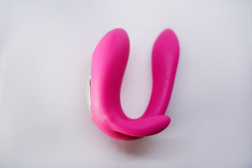 bright sex toys on white background in the studio