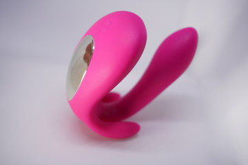 bright sex toys on white background in the studio