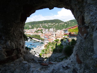 Lerici Harbor viewed through  canon port of the castle Framed view