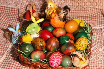 Fototapeta na wymiar The Easter eggs painted in traditional Bulgarian style on the handmade felt mat. Easter eggs painted with Bulgarian traditional symbols