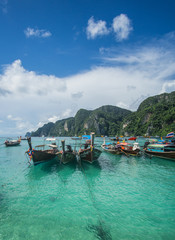 Fototapeta na wymiar Touring around the iconic Phi Phi Islands and the Bamboo island national park. In those places you can find the most beautiful beaches in Thailand with Crystal clear water and white sand. 