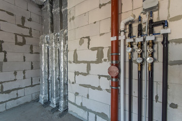 Construction work. Water pipe system.  Installation of ventilation system in the building.