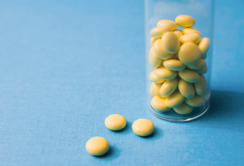 Soothing valerian tablets in a close-up storage container
