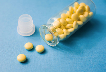 Soothing valerian tablets in a close-up storage container