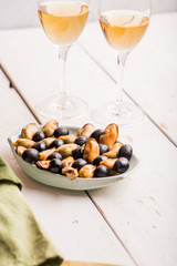 mussels on a plate as an appetizer to white wine