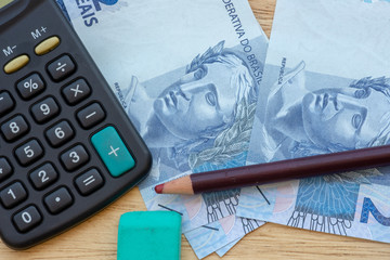 calculator and money to calculate the economy.