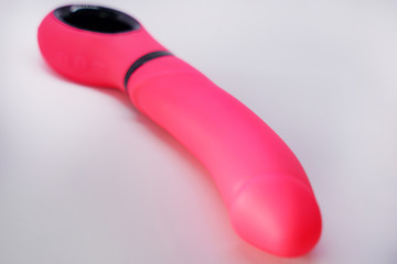 Bright sex toys on white background in the studio isolated