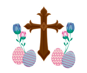 wooden catholic cross with eggs of easter and flowers