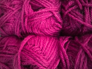 Skeins with different colors of threads for knitting, for needlework