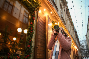 Female photographer outdoors on Christmas eve