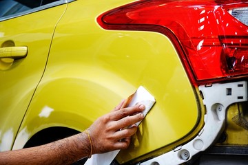 Car body work auto repair paint after the accident during the spraying automotive