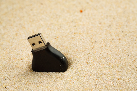 Usb Flash Drive Lost In The Sand On The Beach