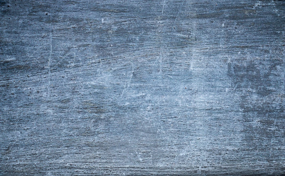 Rough blue gray concrete wall with gritty texture. Grunge background