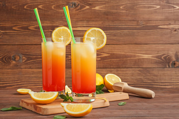 Glasses of Tequila Sunrise cocktail on table