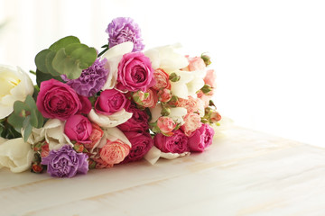 Bouquet of beautiful flowers on table