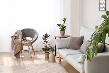 Light curtains with stylish furniture in interior of room