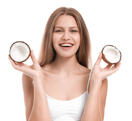 Beautiful young woman with coconut on white background