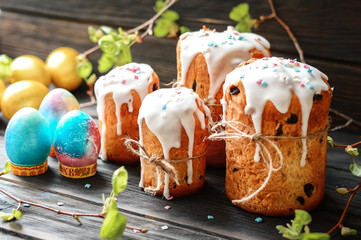 Easter composition with orthodox sweet bread, Easter cake and eggs on a dark background. Easter...