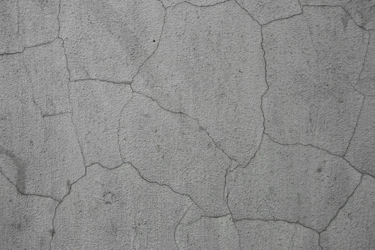 Vintage cracked wall texture. Gray subtle grainy surface. Grunge background