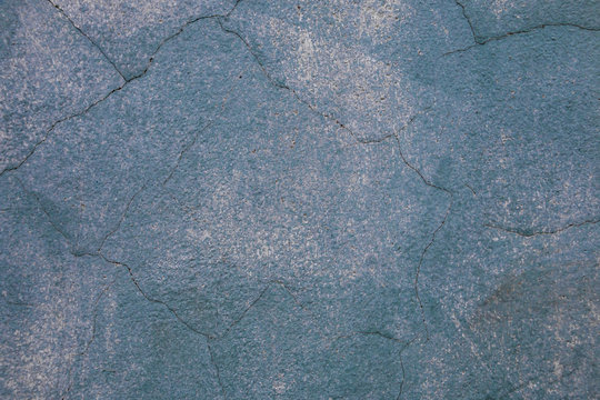 Vintage cracked wall texture. Gray blue subtle grainy surface. Grunge background