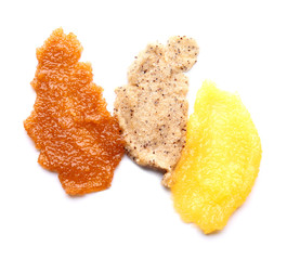 Samples of body scrub on white background