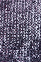 Fabric with sequins and sequins of bright colors. Fashion glitter fabric, sequins. Shiny surface