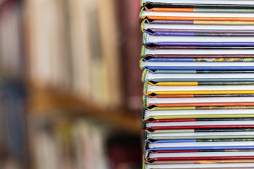 A stack of colorful books close up. A stack of multi-colored books close-up. View of the spine of...