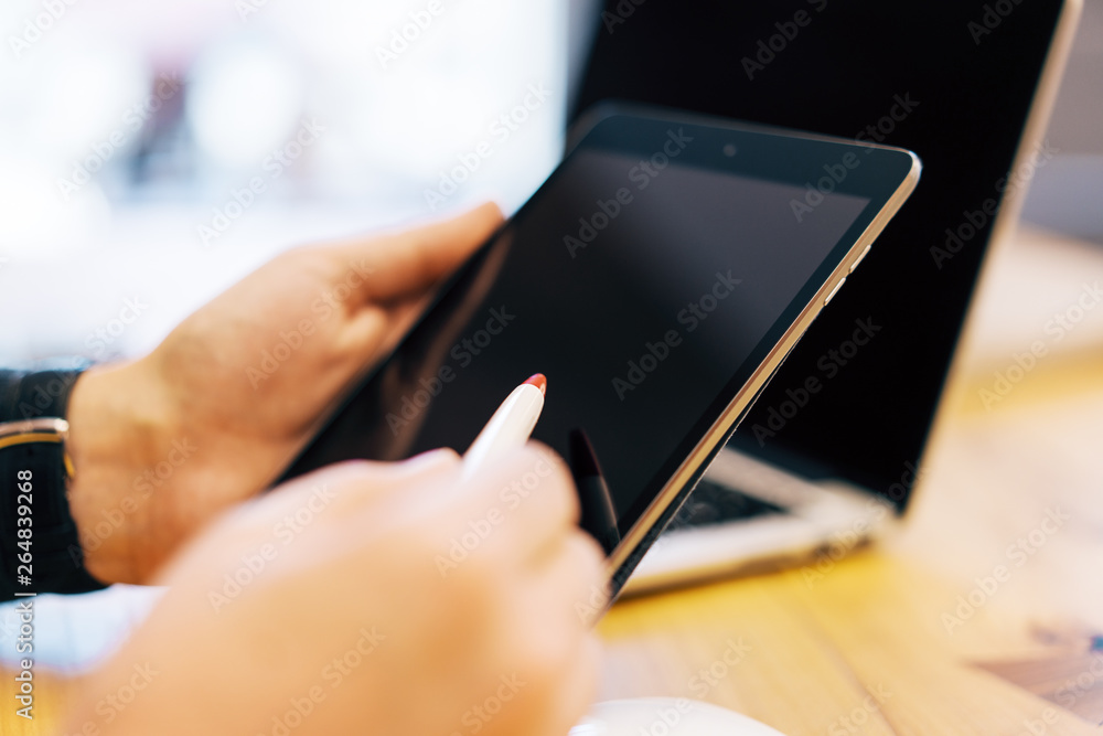 Poster sideview of businessman hand using devices