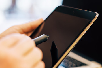 Sideview of man hand using devices