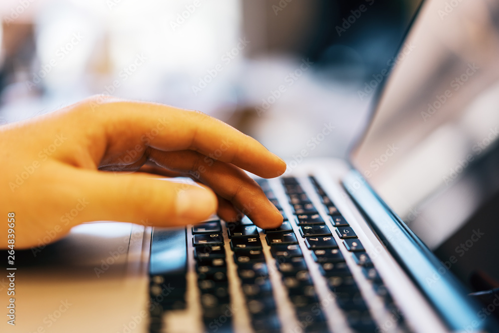 Aufkleber sideview of businessman using laptop on desk top