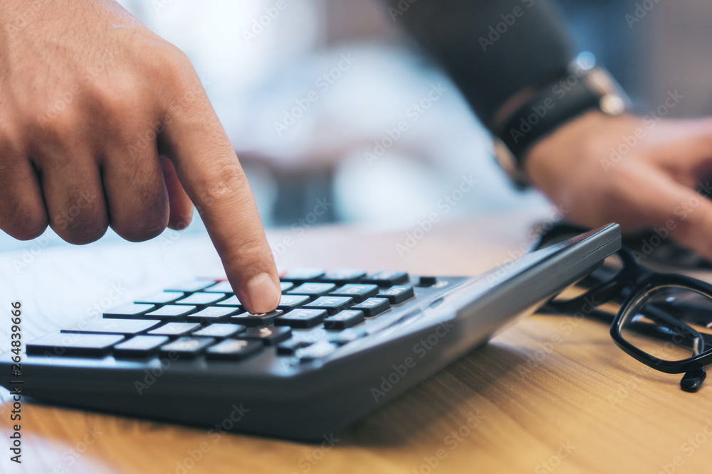 Poster man using laptop and calculator