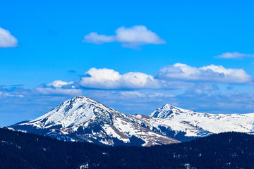 Fototapeta na wymiar winter landscapes of Ukrainian and Romanian Carpathians ,Snow Mountain with Blue Sky