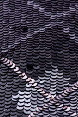 Fabric with sequins and sequins of bright colors. Fashion glitter fabric, sequins. Shiny surface