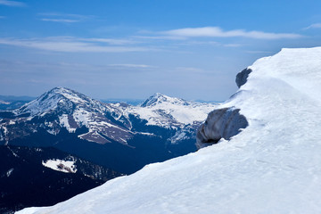 Winter mountain top with fairy overhang snow cap