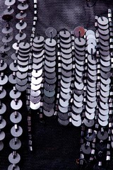 Fabric with sequins and sequins of bright colors. Fashion glitter fabric, sequins. Shiny surface