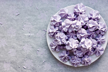 Purple meringues, sweet meringue crisp cookies made from egg whites and sugar for topping desserts or kid treats