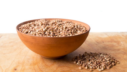 Buckwheat in the bowl on the table