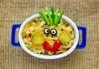 Fun food idea for kids - american mac and cheese macaroni pasta baked with cheesy sauce decorated...