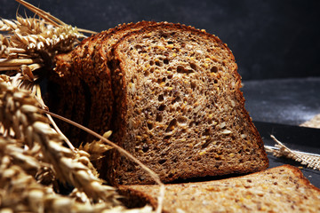 bread on black board from above. Kitchen or bakery poster design with bread.