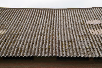Roof with asbestos plates