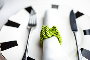 Fine serving, napkin, fork and knife on a plate