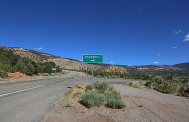 A road sign for Paradox, Colorado, shot off of I90.