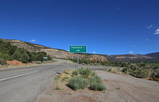 A road sign for Paradox, Colorado, shot off of I90.