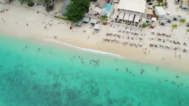 Grand Cayman -  a beach-bar  on the famous Seven Mile beach A high aerial shot of a beach-bar on the famous Seven Mile beach at Grand Cayman Caribbean island