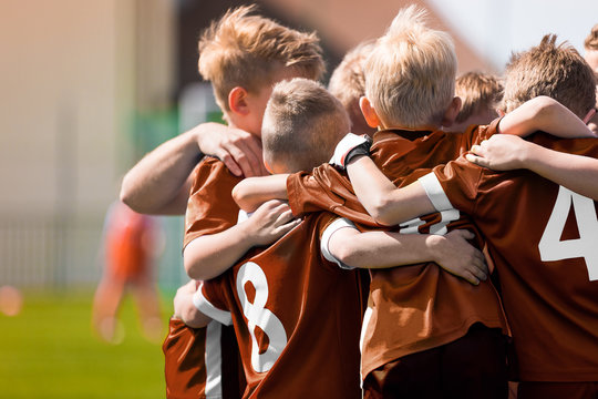 Children Sports Soccer Team. Kids Celebrating Football Victory. Winning Youth Boys Soccer Team © matimix