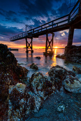 Sunset scenic landscapes of rocky beaches and mountains of the Pacific North West's Bowen Island in...