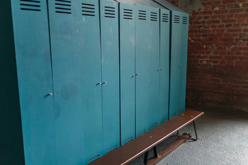 Large green lockers in the sports locker room